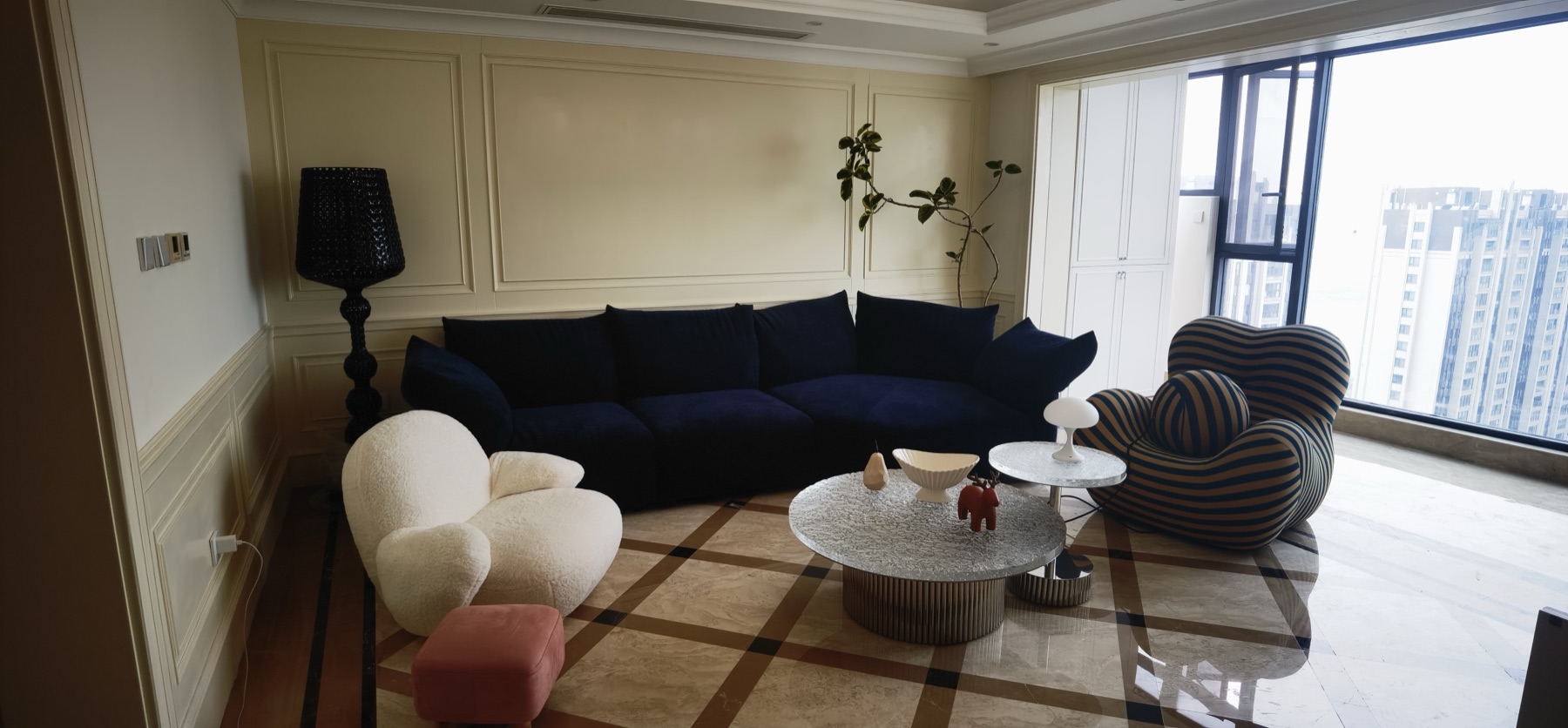 CXCASA client high-rise living room with sofa and accent chairs